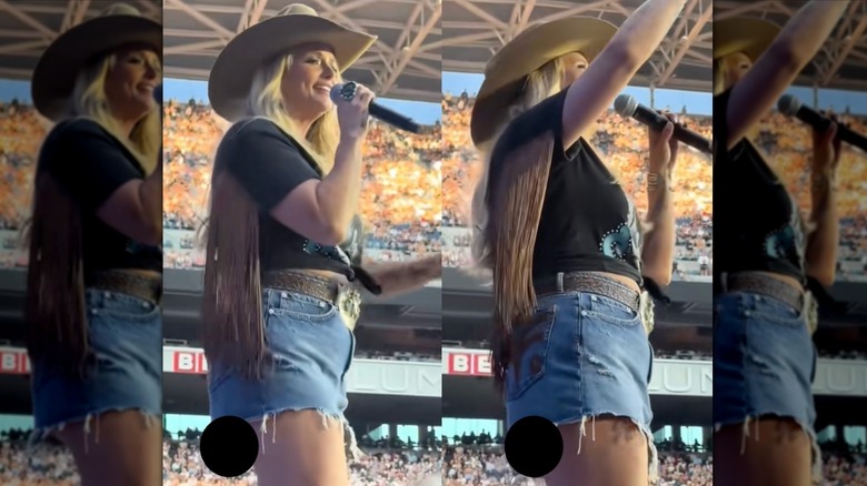 Miranda Lambert canta en el escenario durante un concierto con falda corta