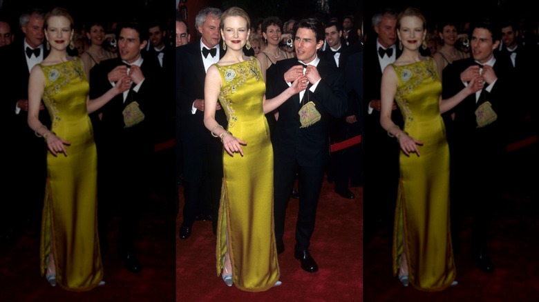Nicole Kidman sonríe luciendo un vestido de satén verde junto a Tom Cruise
