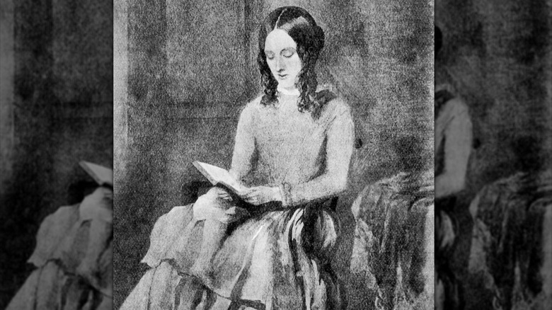 Retrato de Charlotte Brontë leyendo un libro